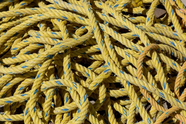 Yellow polymer rope texture in a construction — стоковое фото