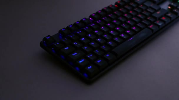 Close-up shot of mechanical keyboard with RGB lighting — стоковое видео