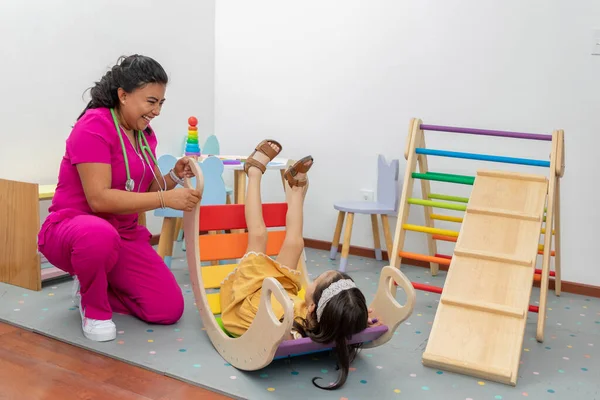 Latina Pediatric Doctor Laughing While Playing Girl Play Area Her — ストック写真