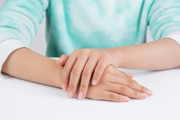 Teenager Hands Referring Hand Care Table — Stockfoto