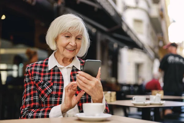 Happy Aged Woman Plaid Jacket Typing Text Message Smartphone Blurred — Stok Foto