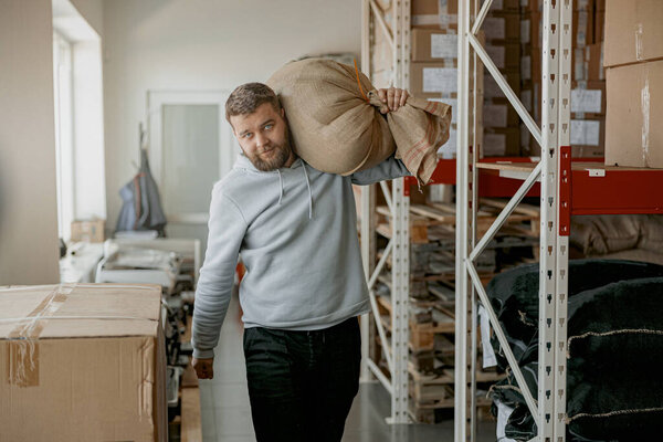Handsome Male Warehouse Worker Carries Bag Coffee Beans Ready Sale Royalty Free Stock Images