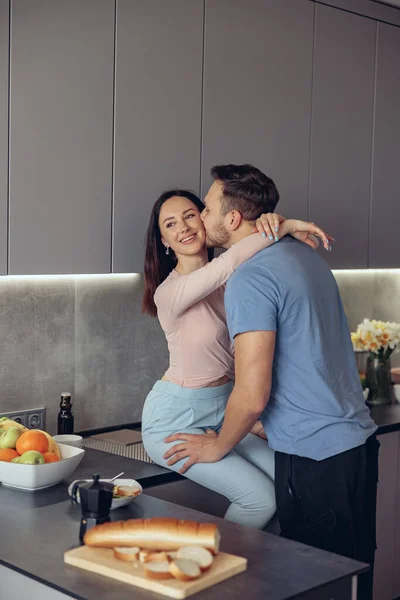 Caucasian Handsome Man Kissing Beauiful Woman Couple Standing Kitchen Morning — Stock Photo, Image