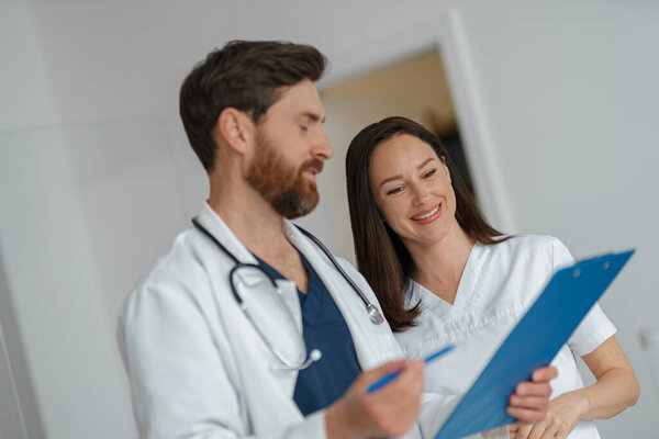 Two Doctor Colleagues Discussing Patient Diagnosis Stand Clinic Hall High Stock Photo