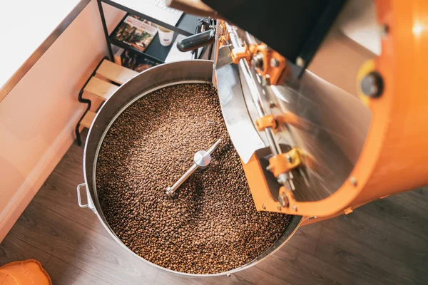 Close up of coffee roasting machine with beans in small coffee manufacturing. High quality photo