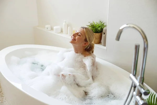 Happy Cheerful Pretty Female Enjoying Bubbles Hot Water Bathtub Spa — Stockfoto