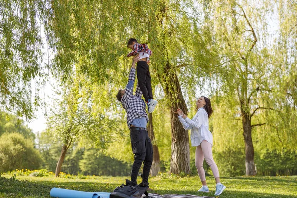 Cheerful Parents Playing Son Park Father Tossing Small Boy Picnic — 图库照片