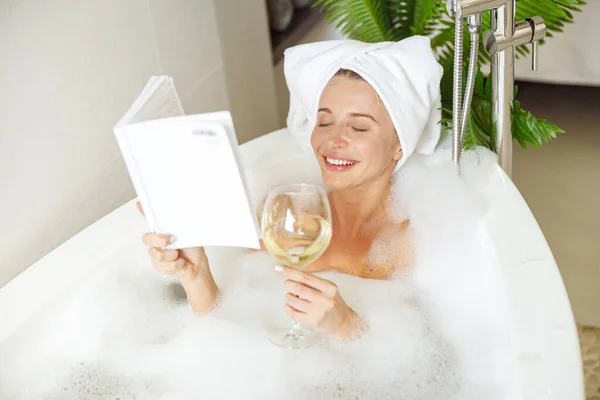 Beautiful Smiled Young Woman Lying Bath Foam Reading Book Drinking — Fotografia de Stock