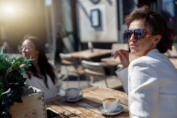Attractive Business Woman Sunglasses Drinking Coffee Sitting Cafe Looking Away — Stok fotoğraf