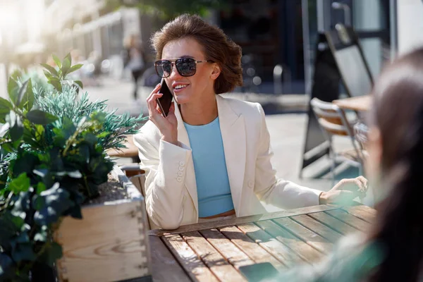 Attractive Business Woman White Suit Sitting Cafe Talking Phone Blurred — Stok Foto