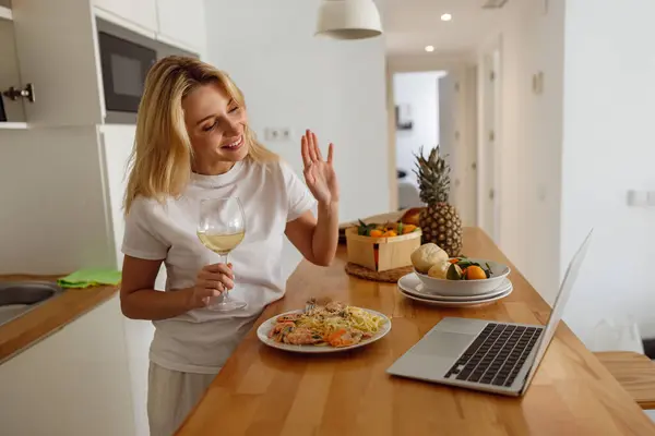 Pretty Blonde Woman Waving Hand Video Chatting Laptop Lunch Home — Stok fotoğraf