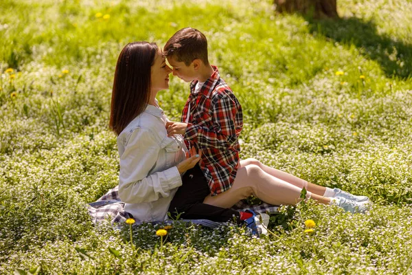 Motherhood Love Young Mother Small Cute Son Green Grass Hugs — Stok fotoğraf