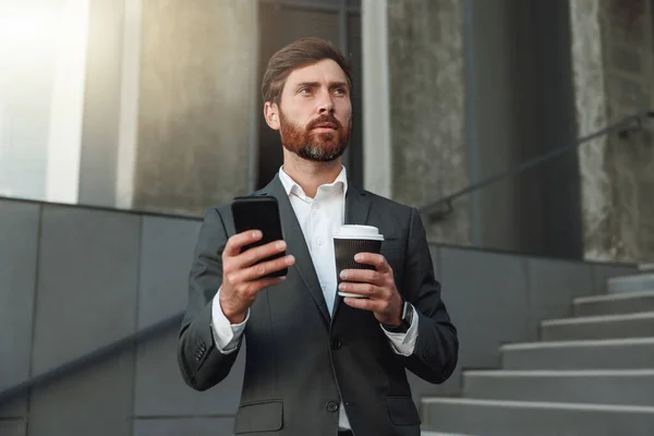 Businessman Suit Standing Stairs Coffee Break Using Phone Blurred Background — ストック写真