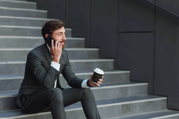 Businessman Suit Sitting Stairs Coffee Break Talking Phone — Foto de Stock
