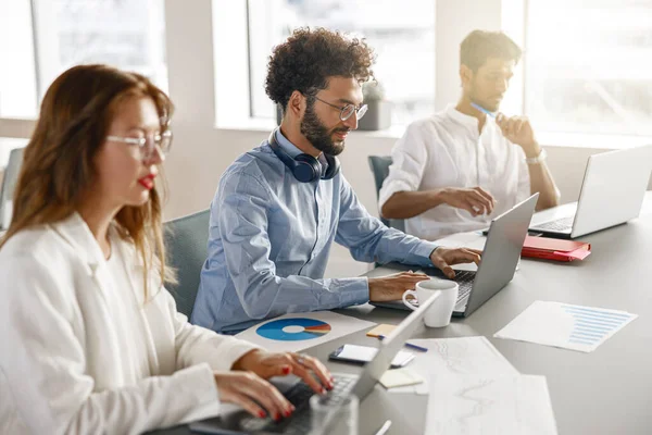 Diverse Coworkers Analyzing Sales Report While Working Together Office Blurred — Photo