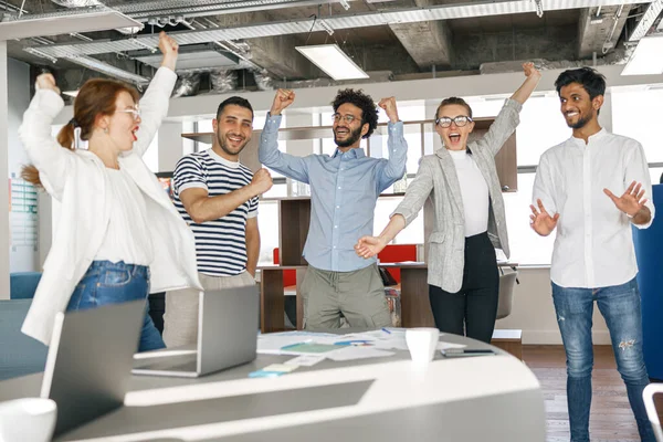 Happy Group Businesspeople Laughing Cheerfully Raised Hands Modern Workplace — ストック写真