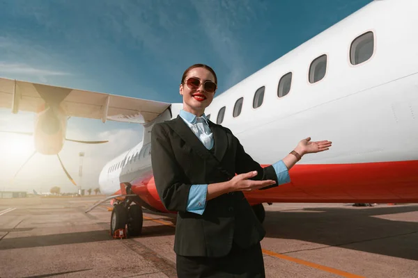 Woman Stewardess Standing Airplane Inviting Board Blurred Background — Stock fotografie