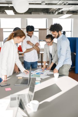 Coworkers cooperating and working together at office meeting, teamwork concept. High quality photo