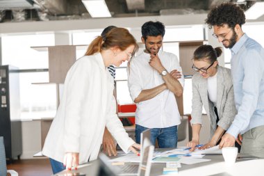 Coworkers cooperating and working together at office meeting, teamwork concept. High quality photo