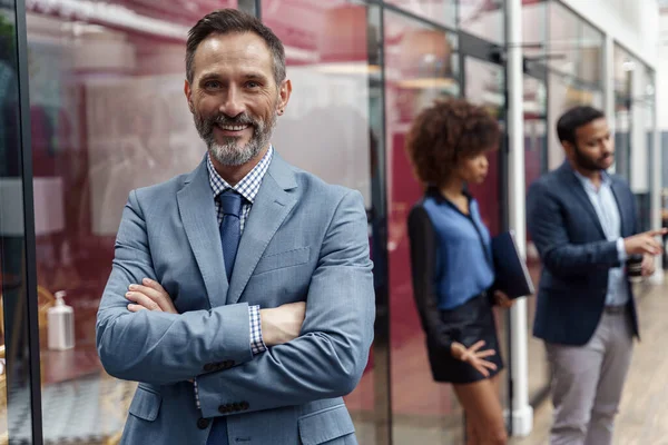 Handsome Mature Businessman Standing Modern Office Colleagues Background Looking Camera — ストック写真