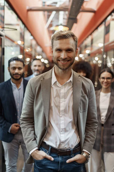 Smiling Handsome Businessman Standing Office Looking Camera High Quality Photo — Stockfoto