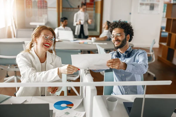 Diverse Coworkers Analyzing Sales Report While Working Together Office Blurred — Foto Stock