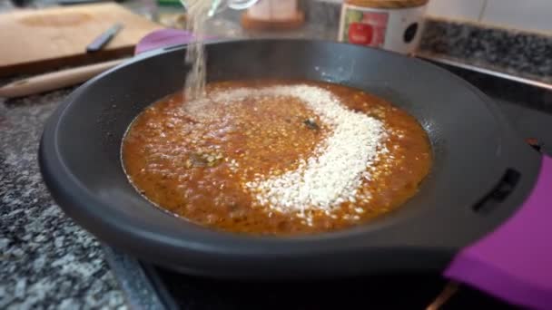 Close Throwing Rice Paella Other Ingredients — Stock Video