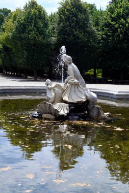 Vienna, Austria - August 01, 2022:  Western Naiad fountain with sculpture in former residence of the Habsburg rulers and today a UNESCO World Heritage Site, world-famous tourist attraction situated in a large park landscape with the oldest zoo in the