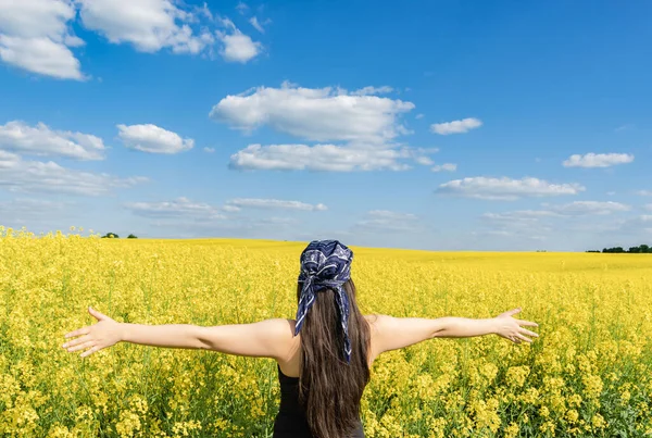 Girl Open Arms Stands Background Blooming Rapeseed Field — Stock Photo, Image