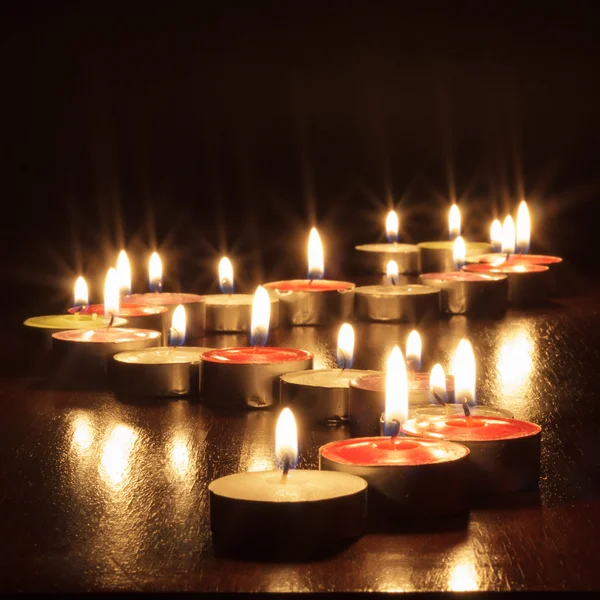 Photograph of candles on black background — Stock Photo, Image