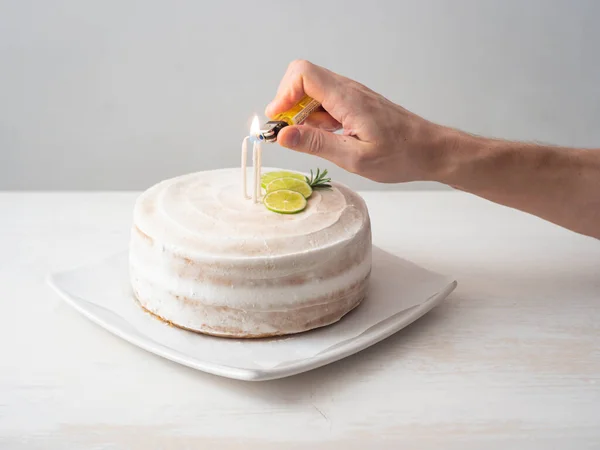 Man Hand Lights Candles Vegan Birthday Cake Almond Coconut Lemon — Fotografia de Stock