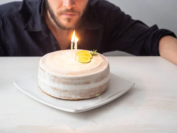 Homem Branco Olha Velas Bolo Aniversário Vegan Com Amêndoa Coco — Fotografia de Stock