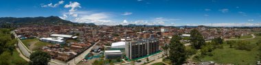 Carmen de Viboral Cityscape with Mountain Range in the Background and Half Built Residential Unit in Antioquia / Kolombiya