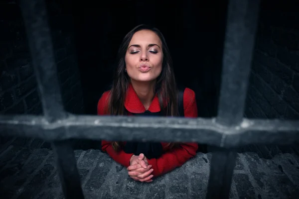 Girl behind bars — Stock Photo, Image