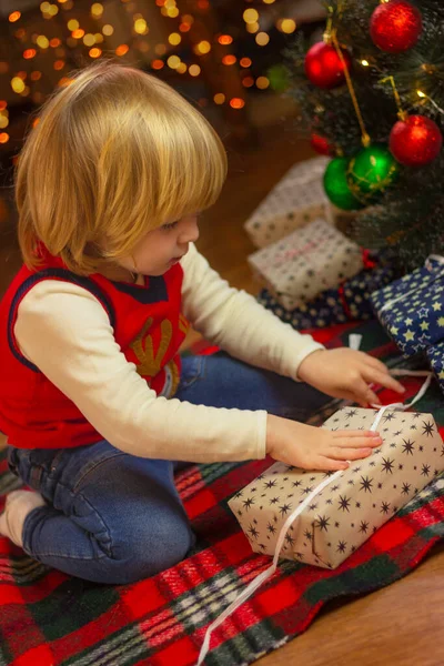 Toddler Boy Unpacks Gift Christmas Tree Christmas New Year Childhood — Stock Photo, Image