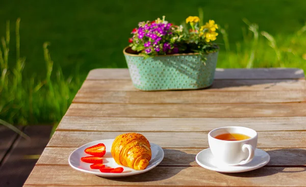 White Cup Tea Plate Croissant Strawberries Wooden Table Garden Background — Stock Fotó