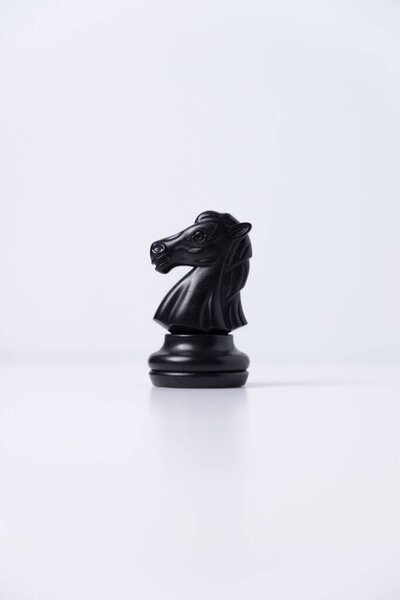 isolated black knight horse chess piece on white background