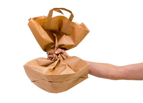 Paper bag in man's hand — Stock Photo, Image