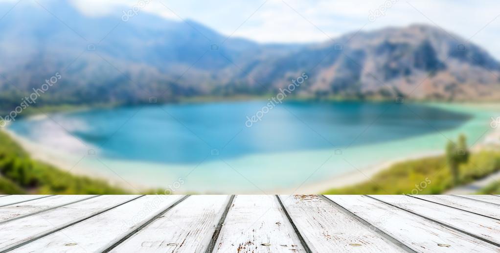 Wooden plank in perspective view and lake Kurnas