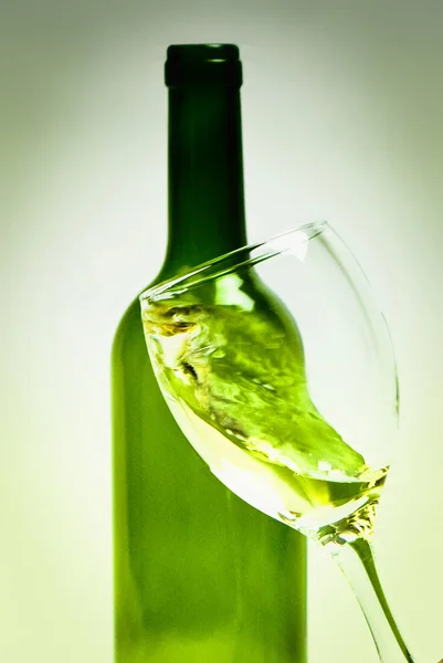 Moving a glass of white wine to be sniffed — Stock Photo, Image