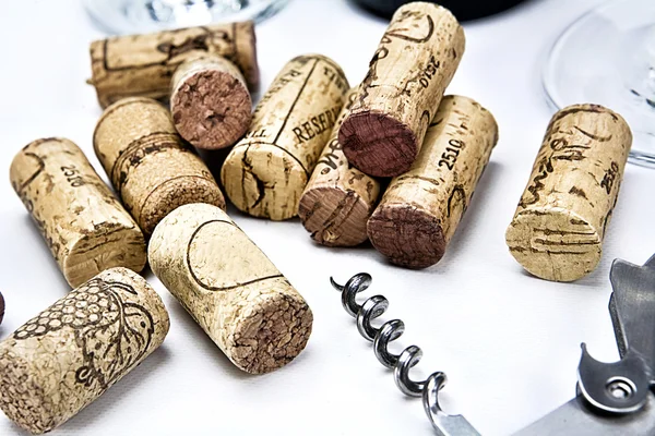 Closeup of a group of wine corks and a corkscrew — Stock Photo, Image
