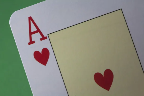 Ace of hearts on green felt — Stock Photo, Image