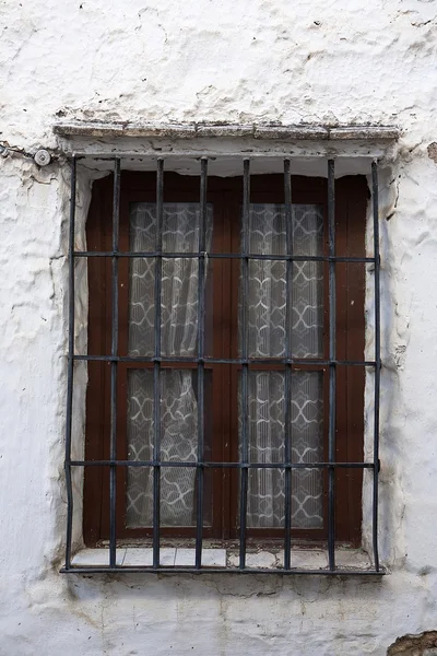 Ancient window in a wall Stock Image