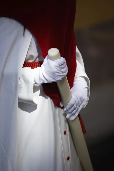 Detail penitent white holding a candle during Holy Week — Stock Photo, Image