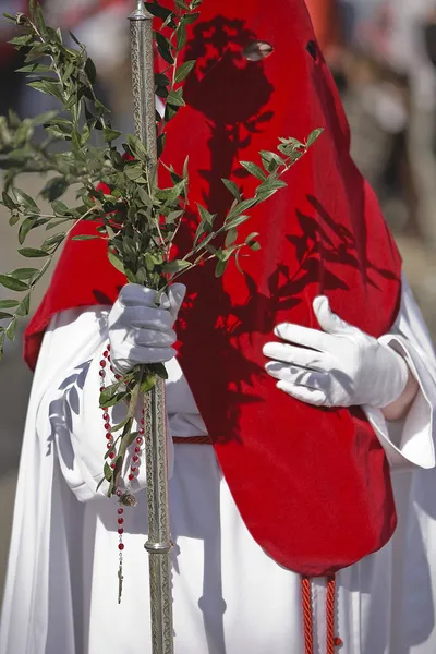 Penitent with a crosier carried olive branches during a procession of holy week on Palm Sunday — Stock Photo, Image