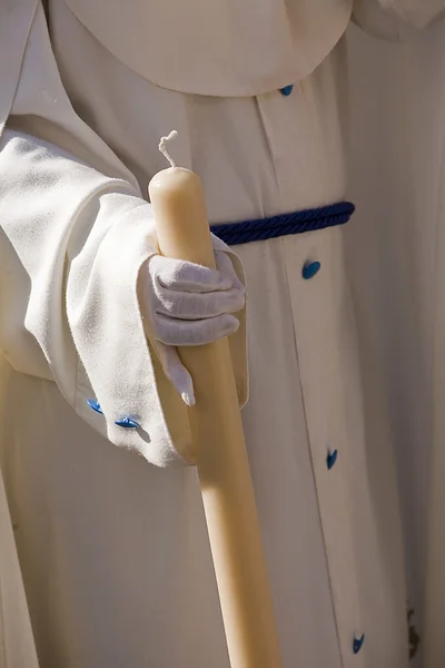 Detail penitent white holding a candle during Holy Week — Stock Photo, Image