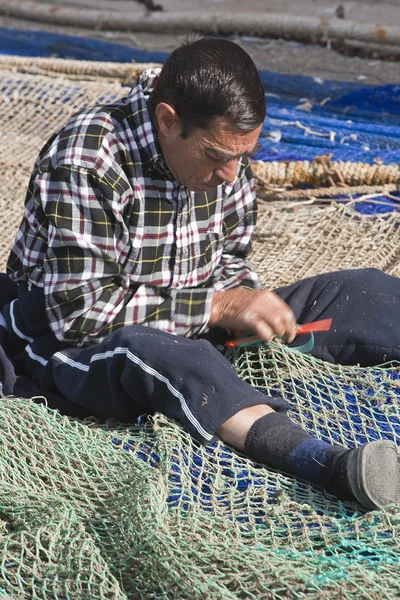 Sailor fixed their fishing nets in the port of Estepona — Stock Photo, Image