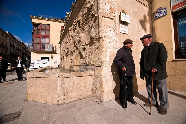 Elders chatting in the source of the poplars — Stock Photo, Image