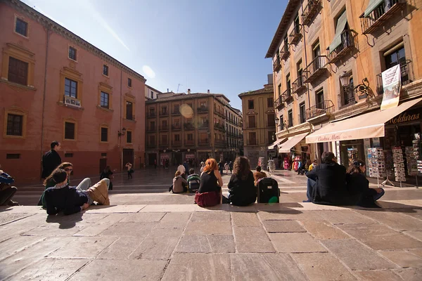 Tourists resting on the steps of the square Las Pasiegas — Stock Photo, Image