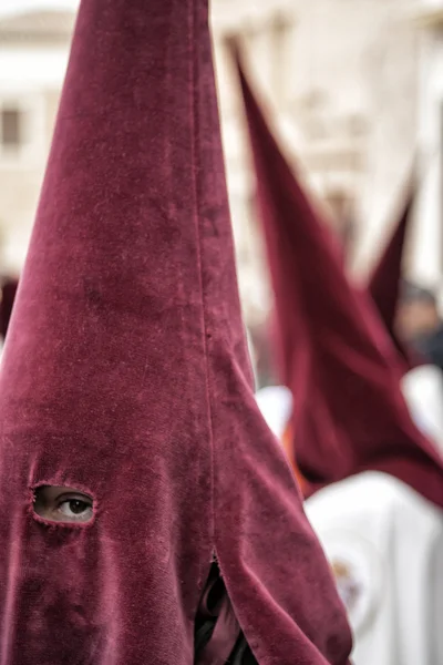 Detail penitent with red caperuz in Holy Week — Stock Photo, Image